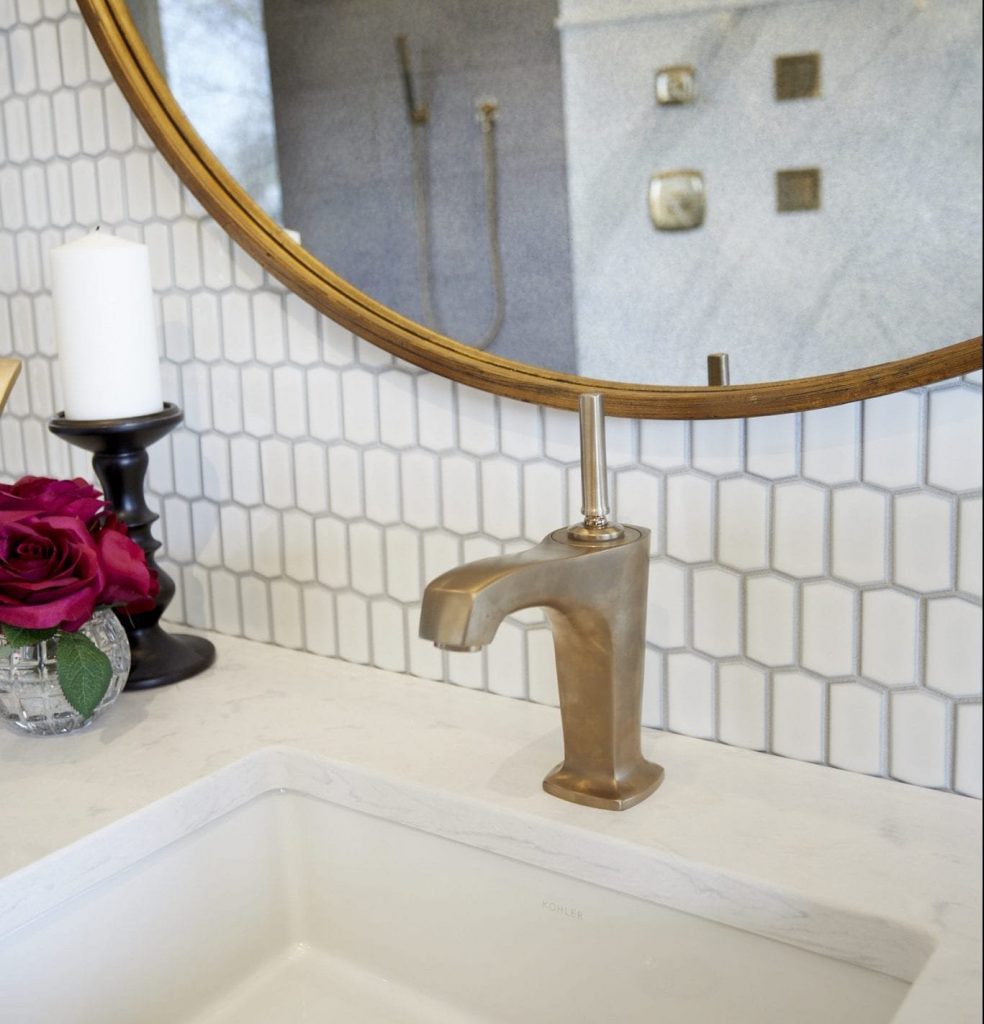 Gold sink fixtures in bathroom renovation